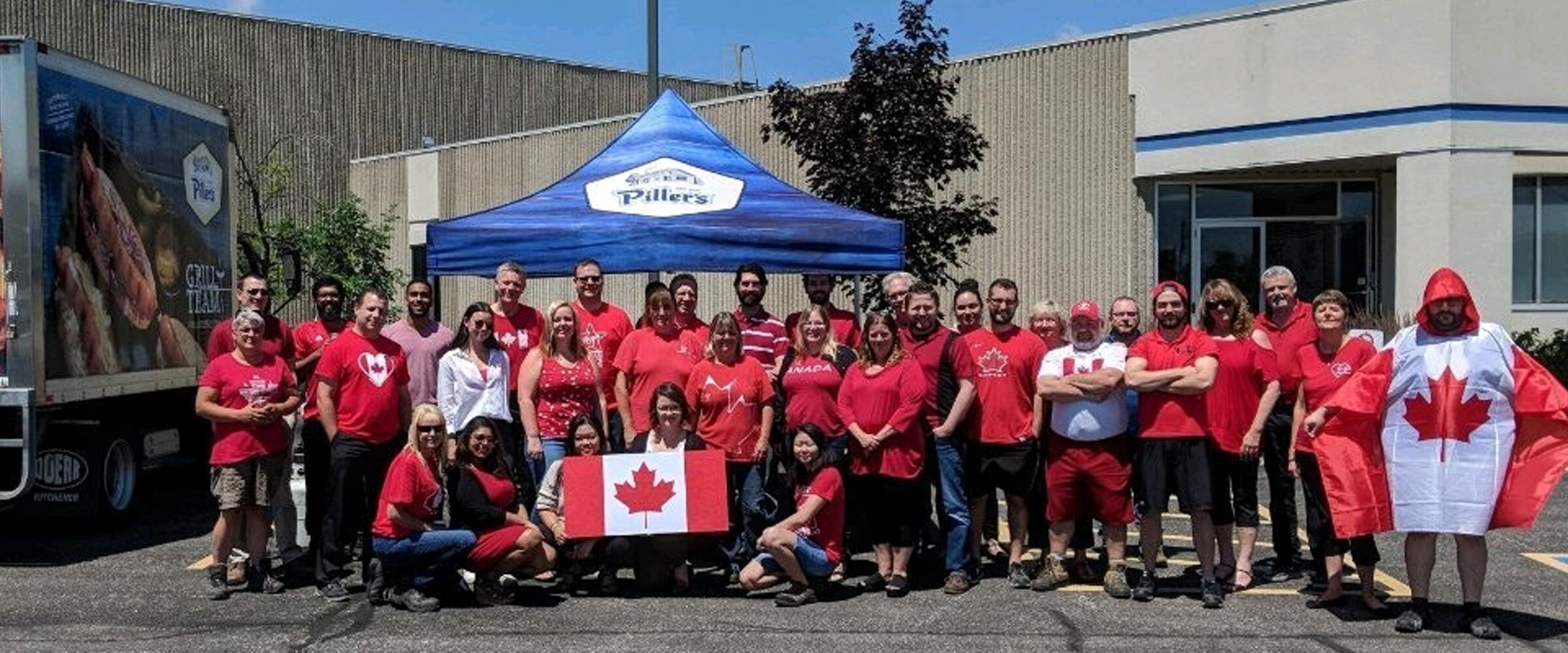 Members of Piller's staff posing outside our plant for Canada day.