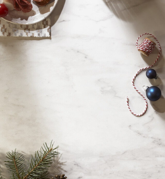 Holiday background with presents and pinecones