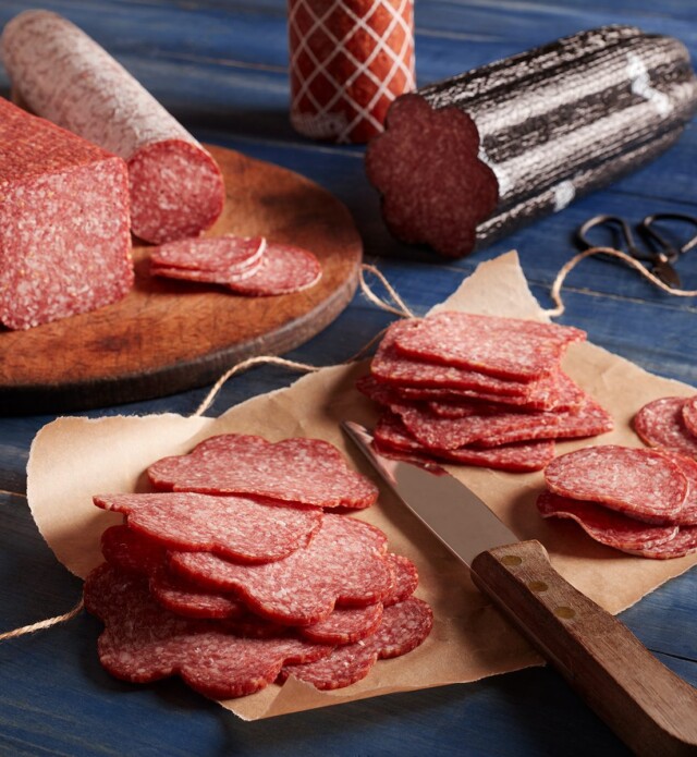 Deli Salami sliced and on parchment paper