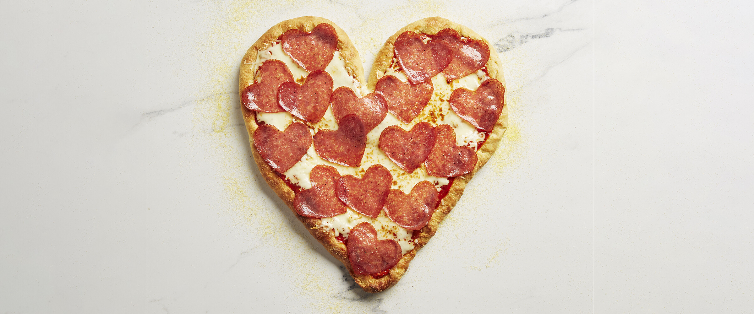 Heart shape pizza with heart salami