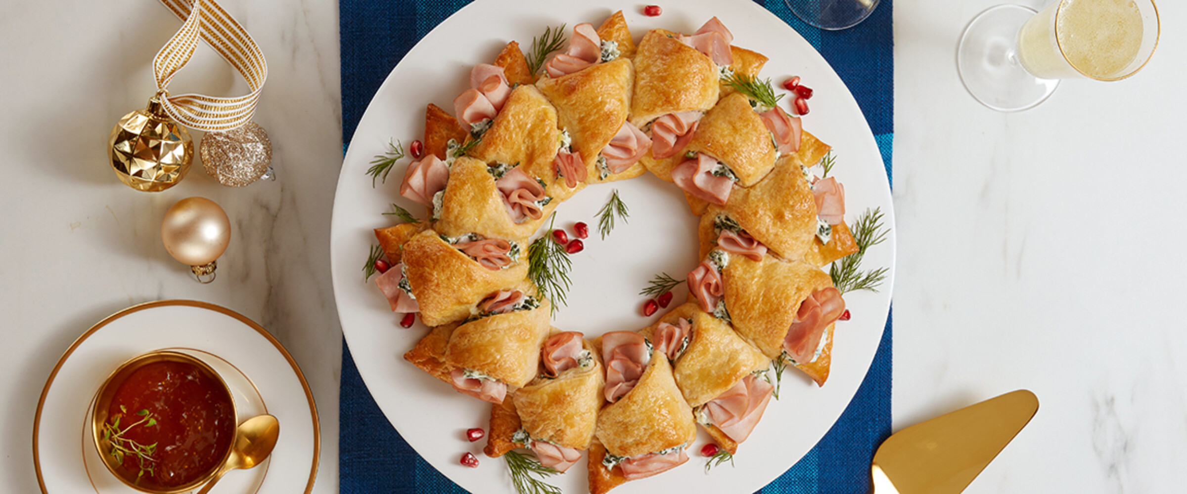 ham and cheese pastry wreath on blue runner