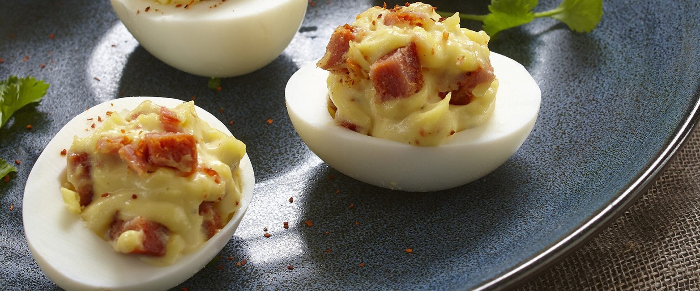 Photo of chorizo devilled eggs with chorizo on a plate