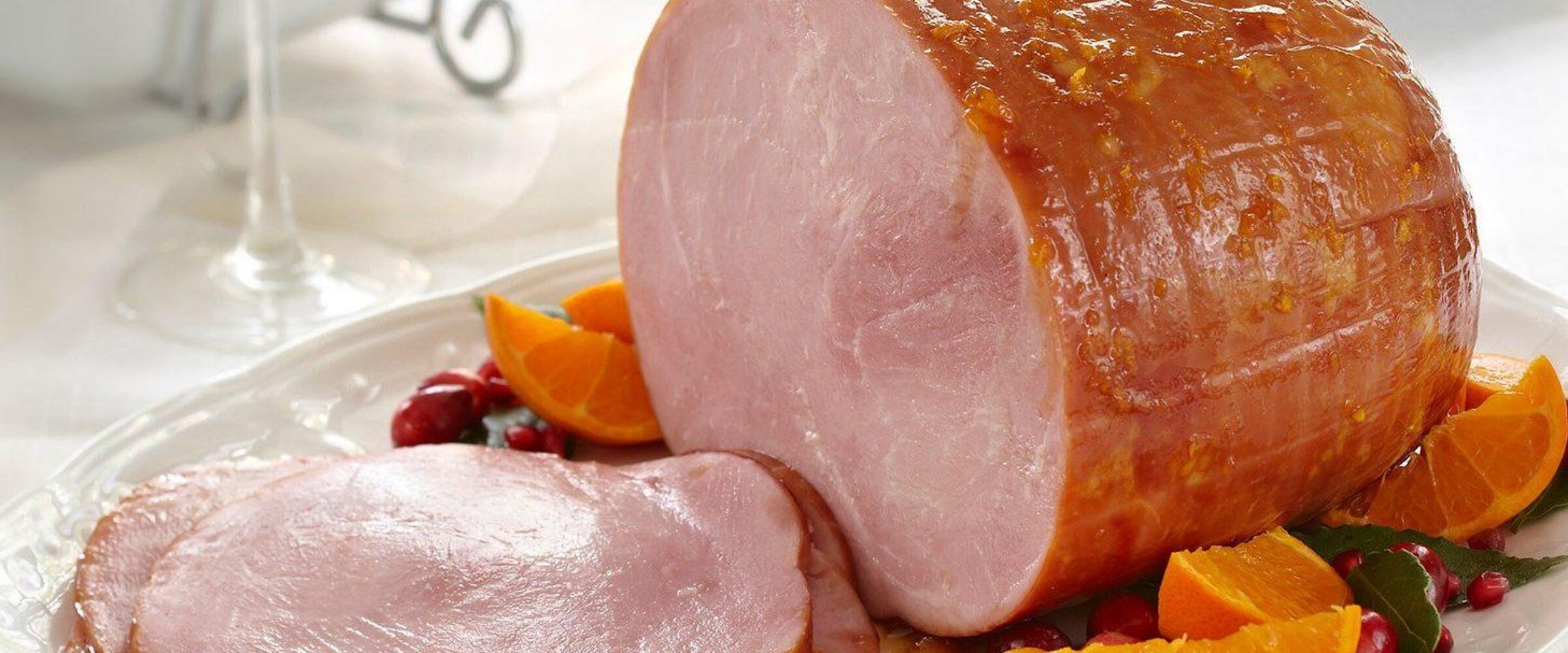 Cranberry orange glazed ham on a plate