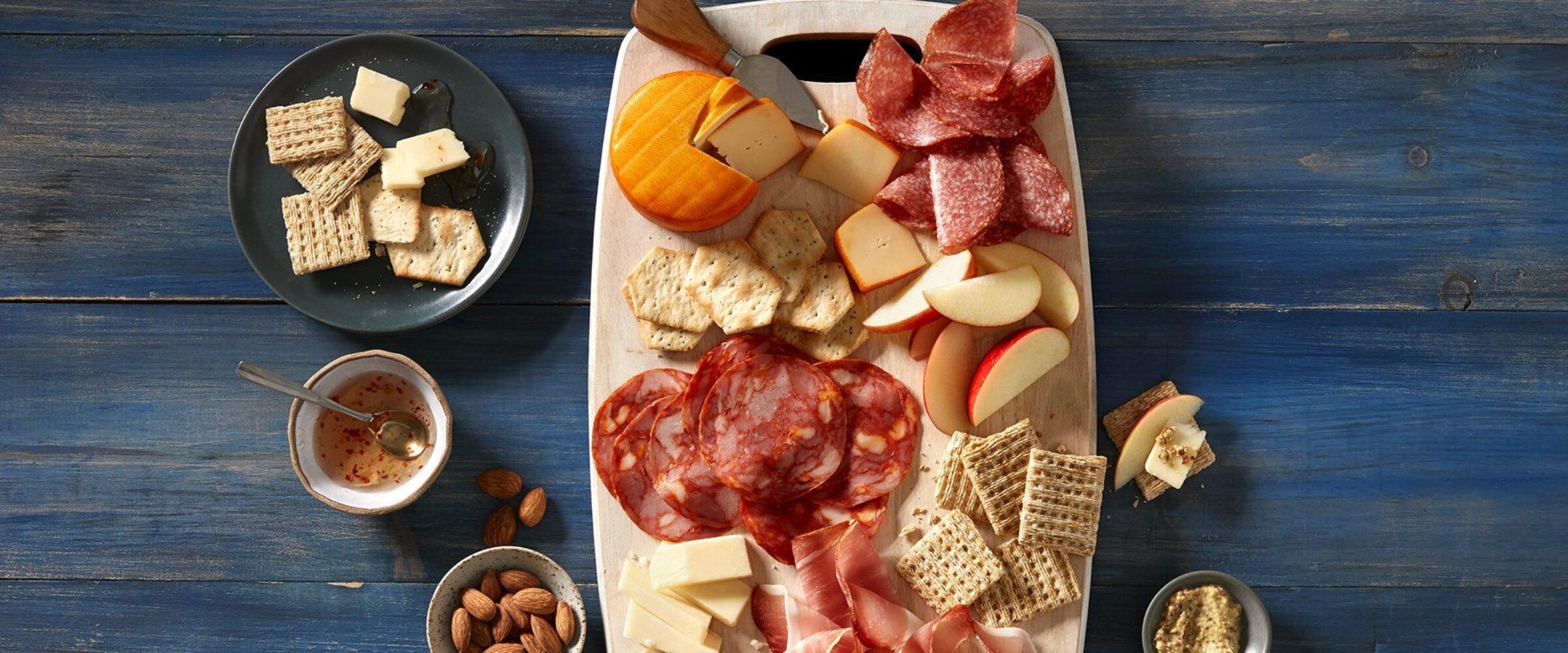 Simple charcuterie board with three meats and cheese