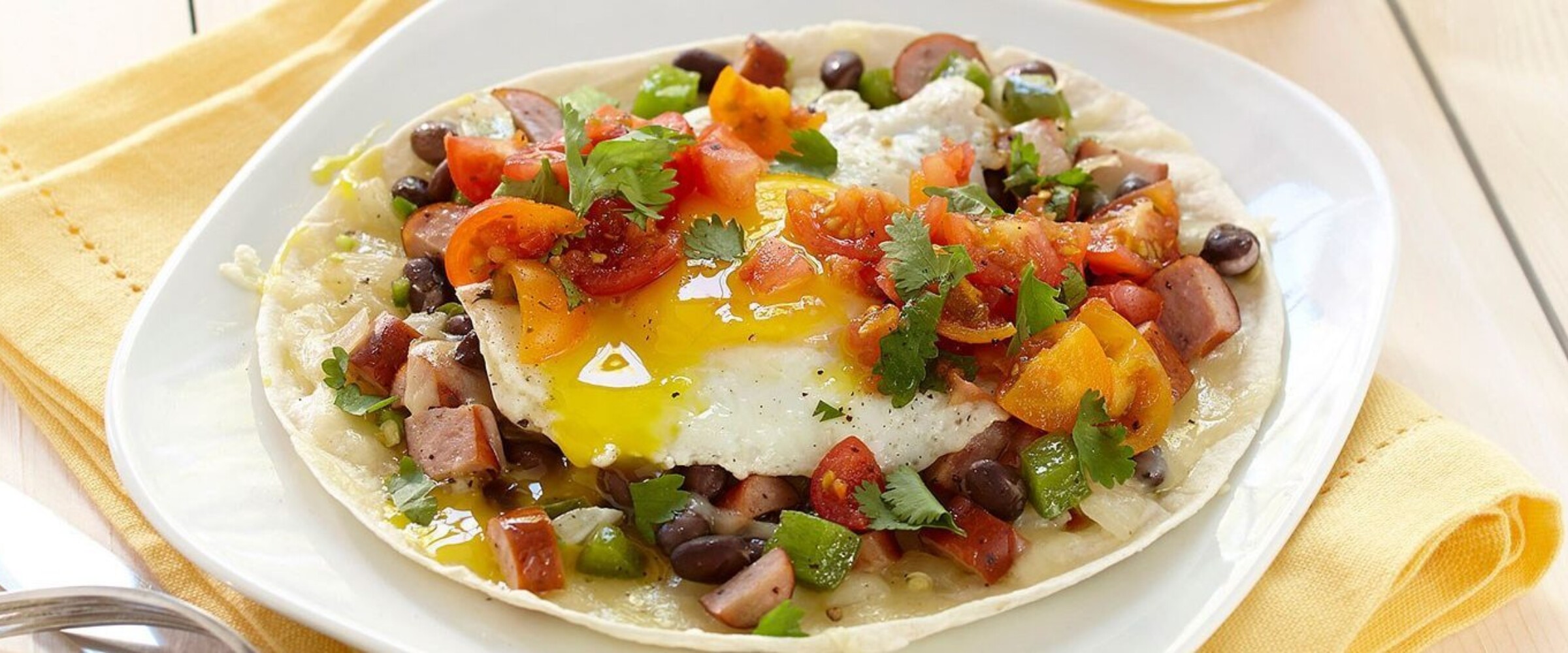 Huevos Ranchos with kolbassa on a plate