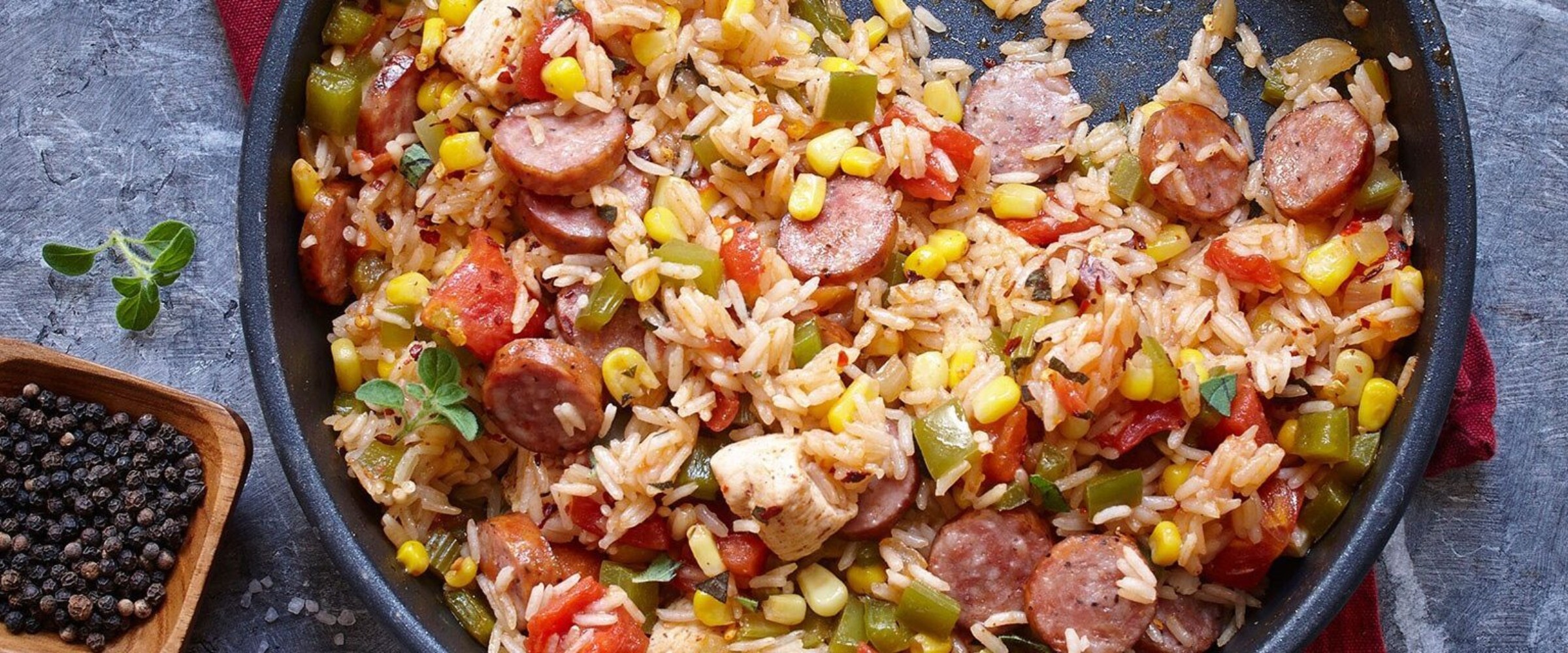 Jambalaya with Grillwurst in skillet