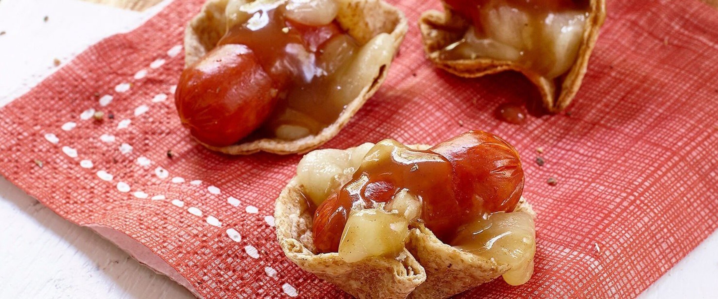 Pepperoni, cheese and gravy on tortilla chips