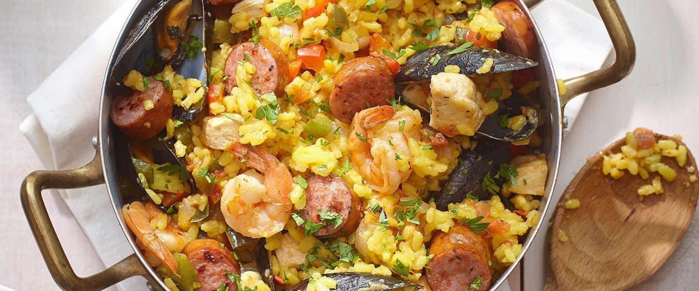 Paella with chicken and sausage in a dish