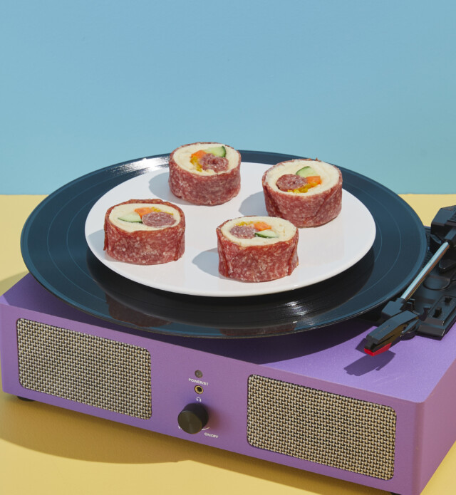 Sushi made of of Salami on a record player spinning