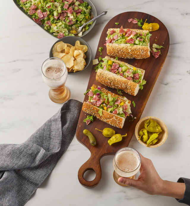 3 Salami Sandwiches on a charcuterie board