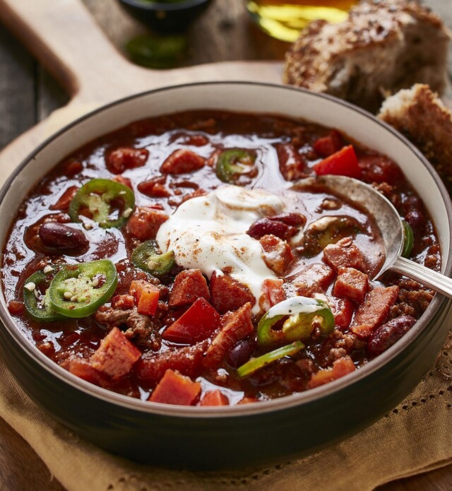 Bowl of chorizo and beef chili with sour cream on top