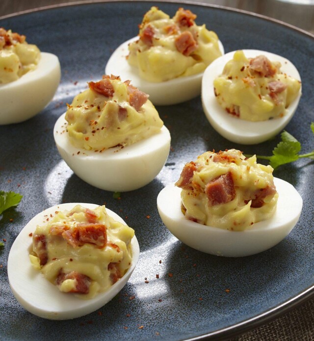 Photo of chorizo devilled eggs with chorizo on a plate