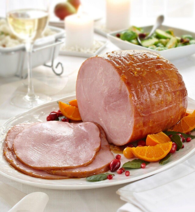 Cranberry orange glazed ham on a plate