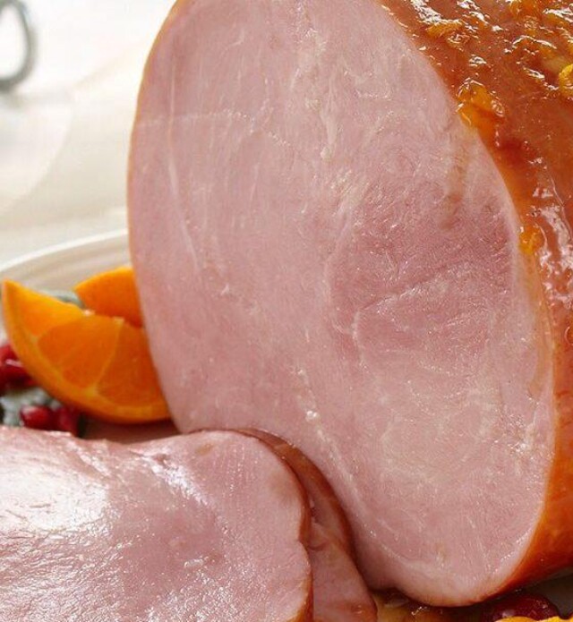 Cranberry orange glazed ham on a plate