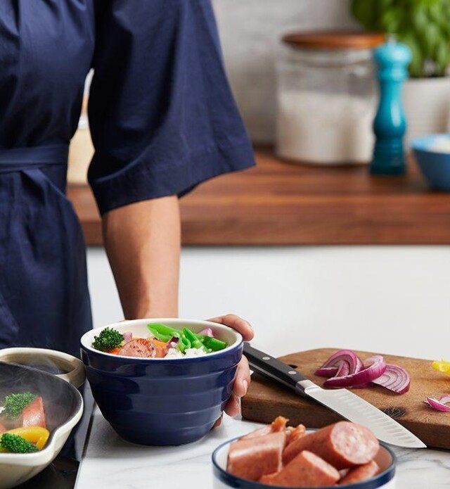 Mother and daughter cooking dinner