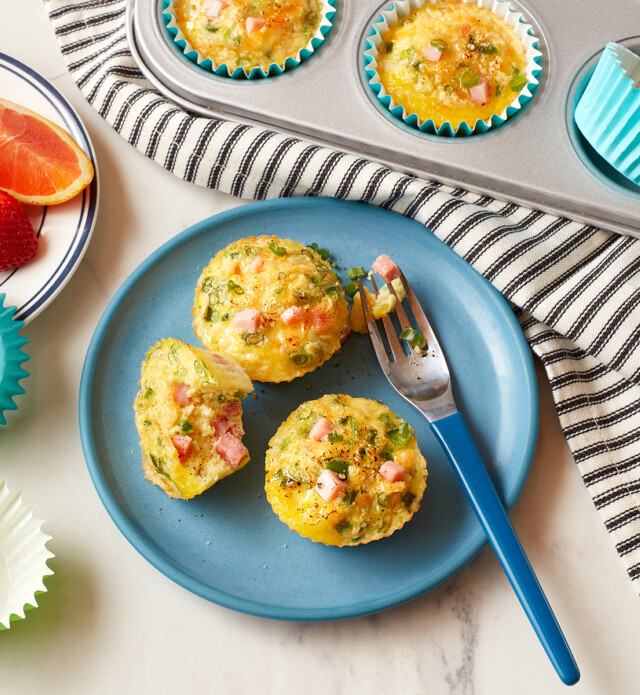 egg bites with ham and cheese on a blue plate