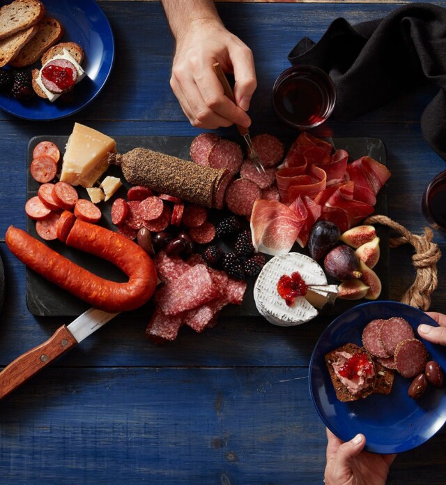 People enjoying charcuterie board