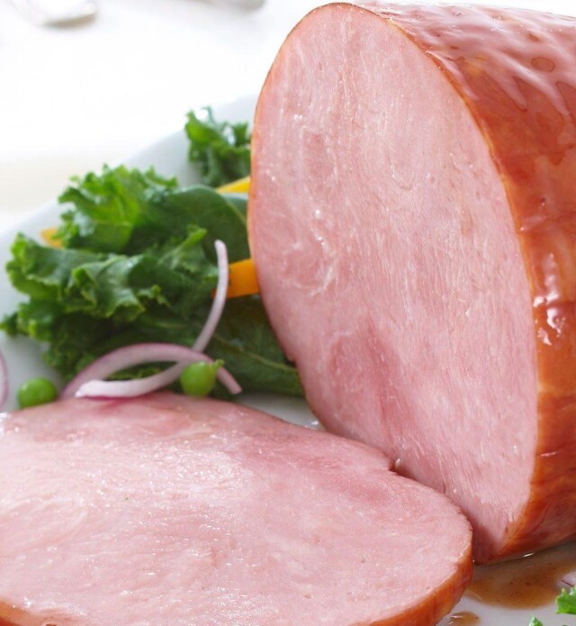 Honey glazed ham on white plate