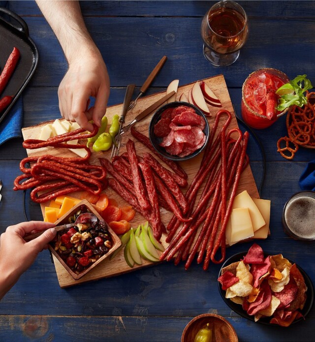 People enjoying snack board