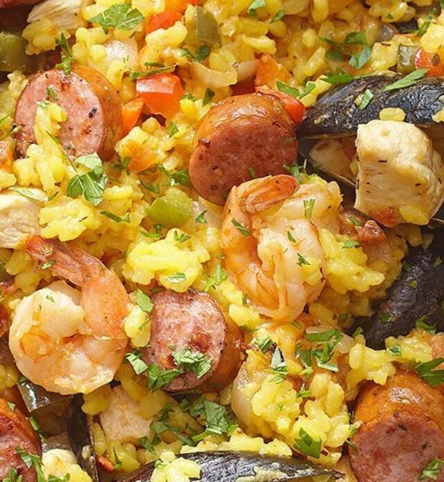 Paella with chicken and sausage in a dish