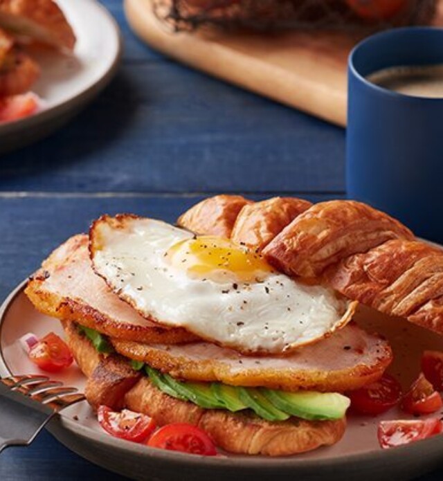 Egg and back bacon on a croissant