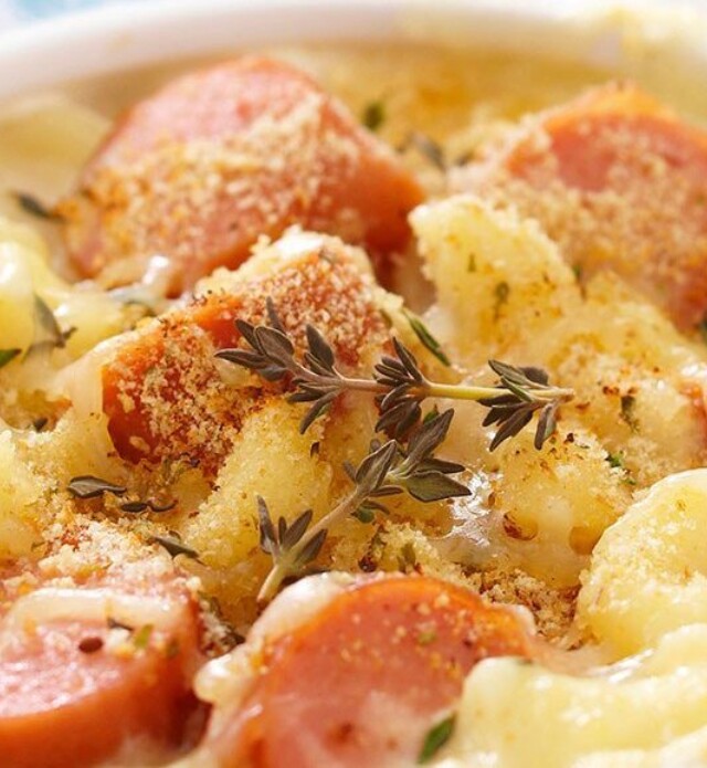 Macaroni casserole with sausage in a white bowl