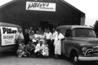 Piller's staff photo in front of the original Piller's location.